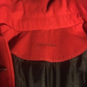 A bright red Calvin Klein women’s XXL coat